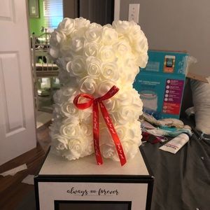 a flower bear. its white. 25cm tall.